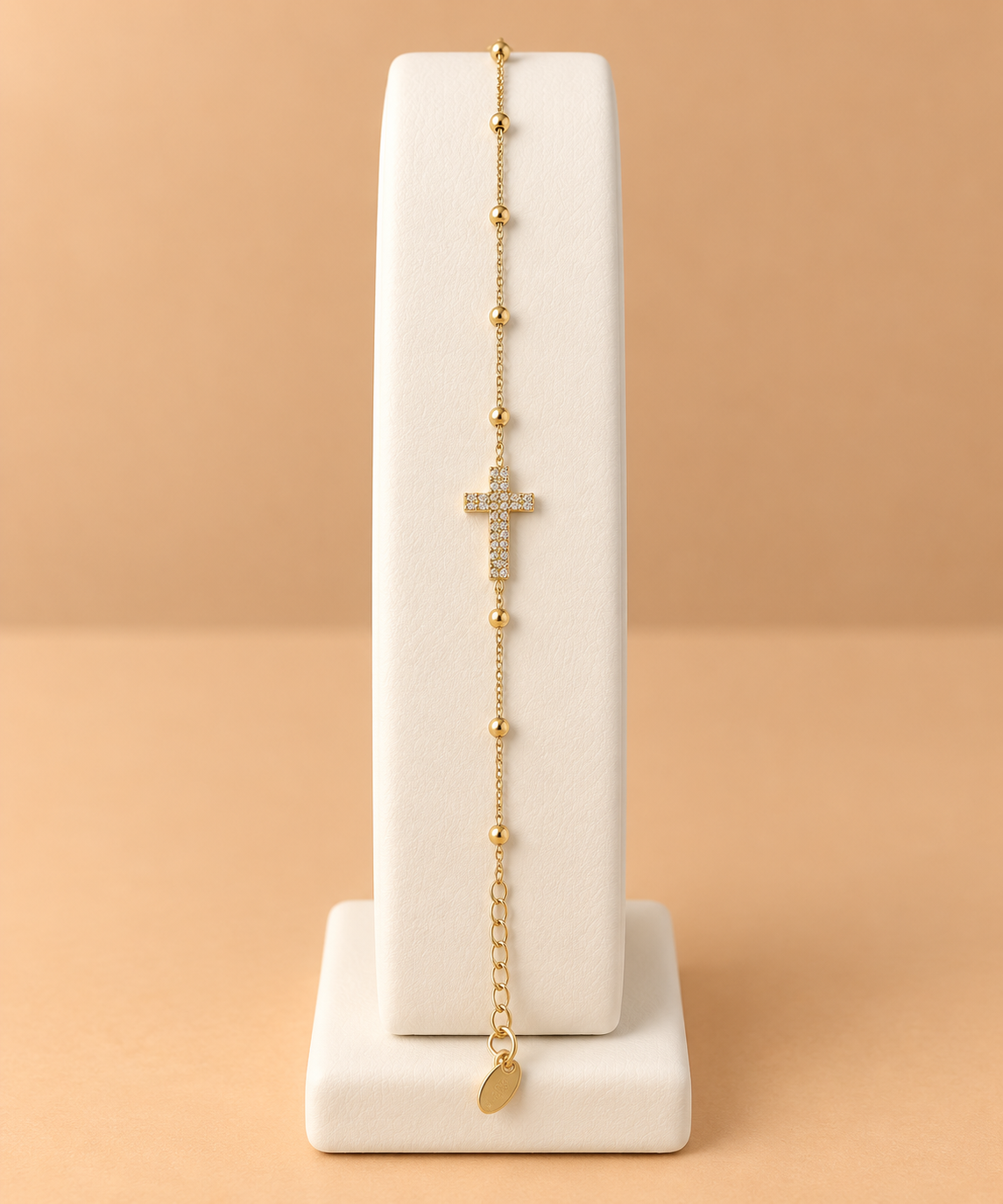 Bracciale dorato con croce e sfere
