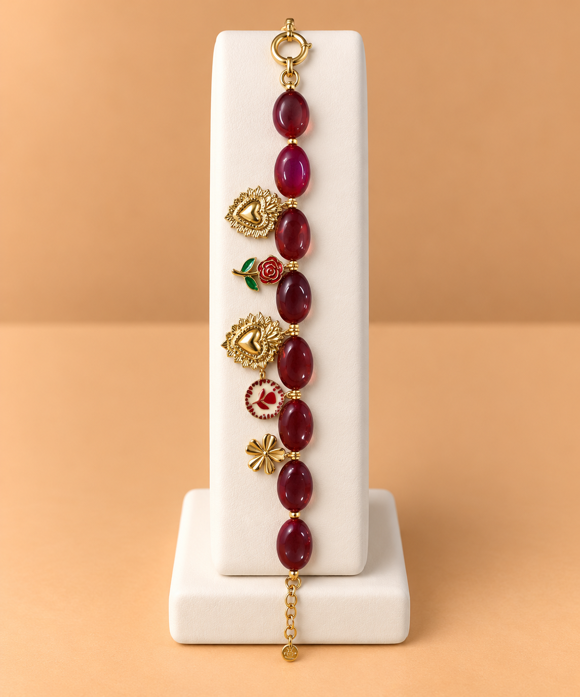 Bracciale bordeaux con pietre e decorazioni dorate